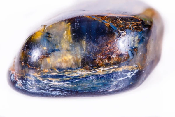 Pietersite Blue Gold Colors Pietersite gemstone displaying characteristic blue and gold swirling patterns and chatoyancy