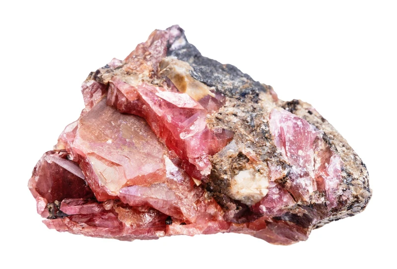Rough unpolished rhodonite stone showing natural pink color and black manganese dendrites
