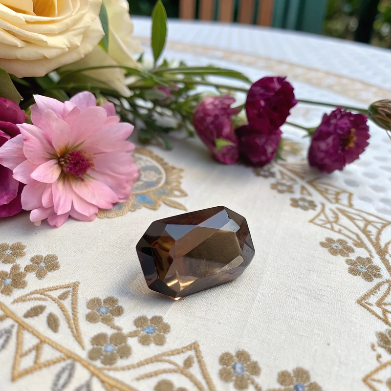 Natural smoky quartz crystal point showing hexagonal termination and smoky brown coloration