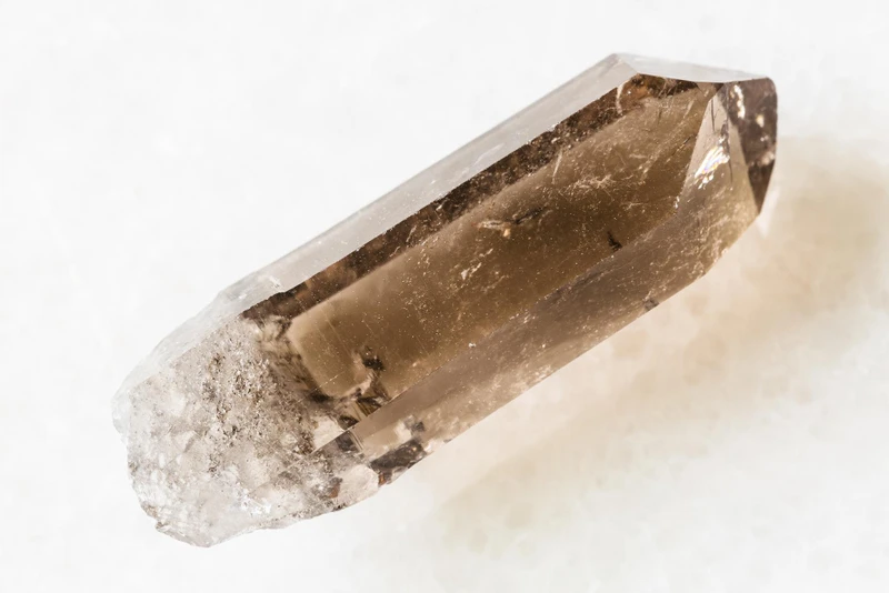Smoky quartz pendant set in sterling silver showing natural crystal point
